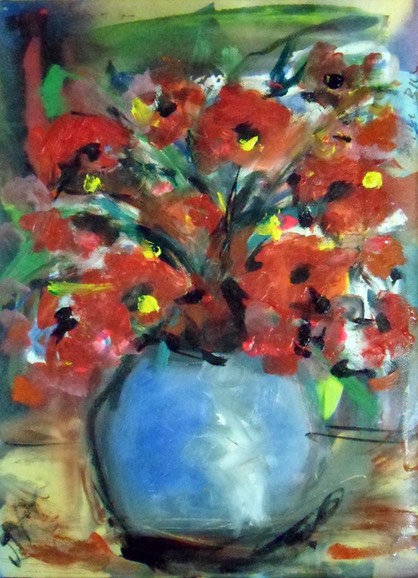 poppies in blue vase